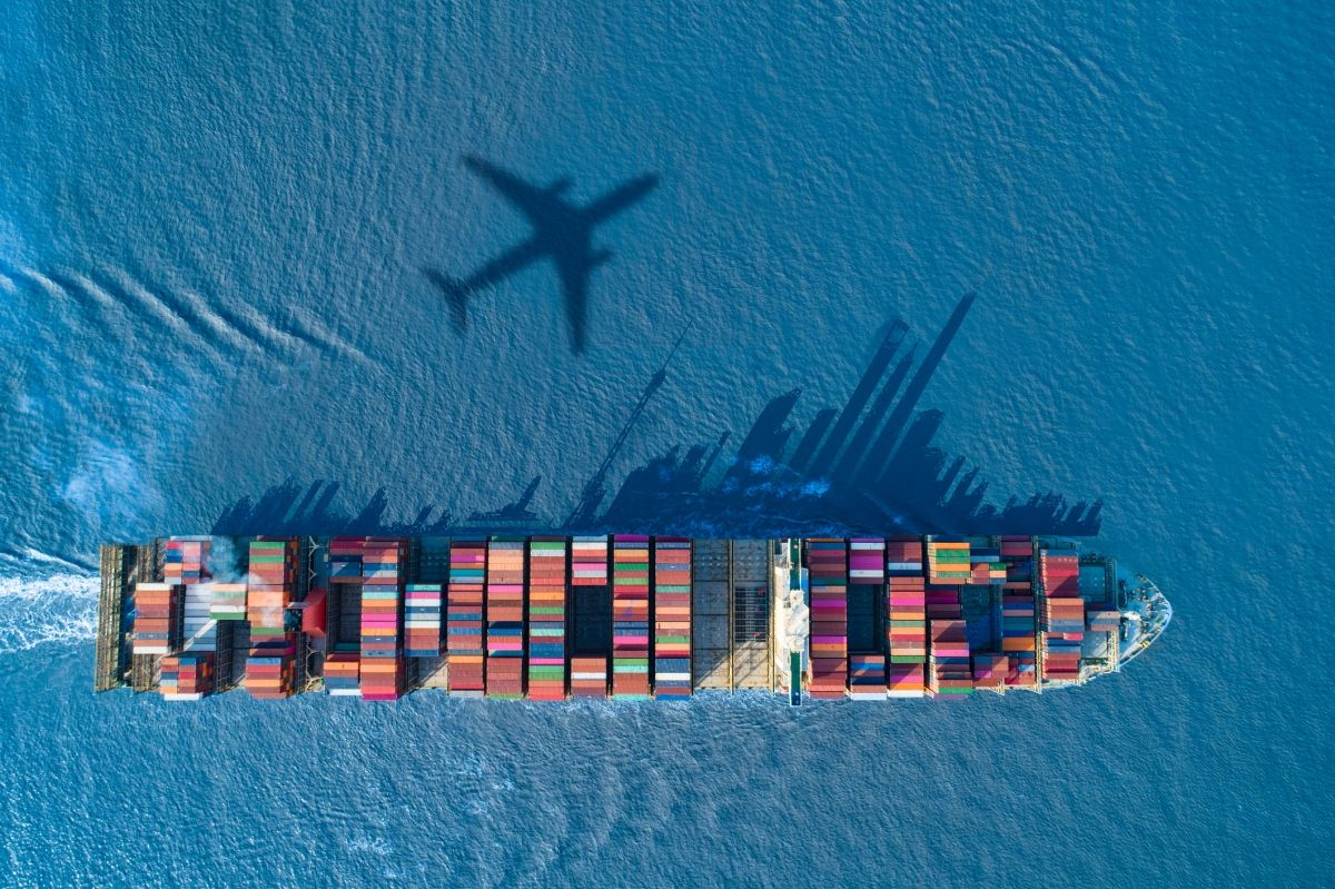 Ali Trading Company cargo ship with airplane shadow